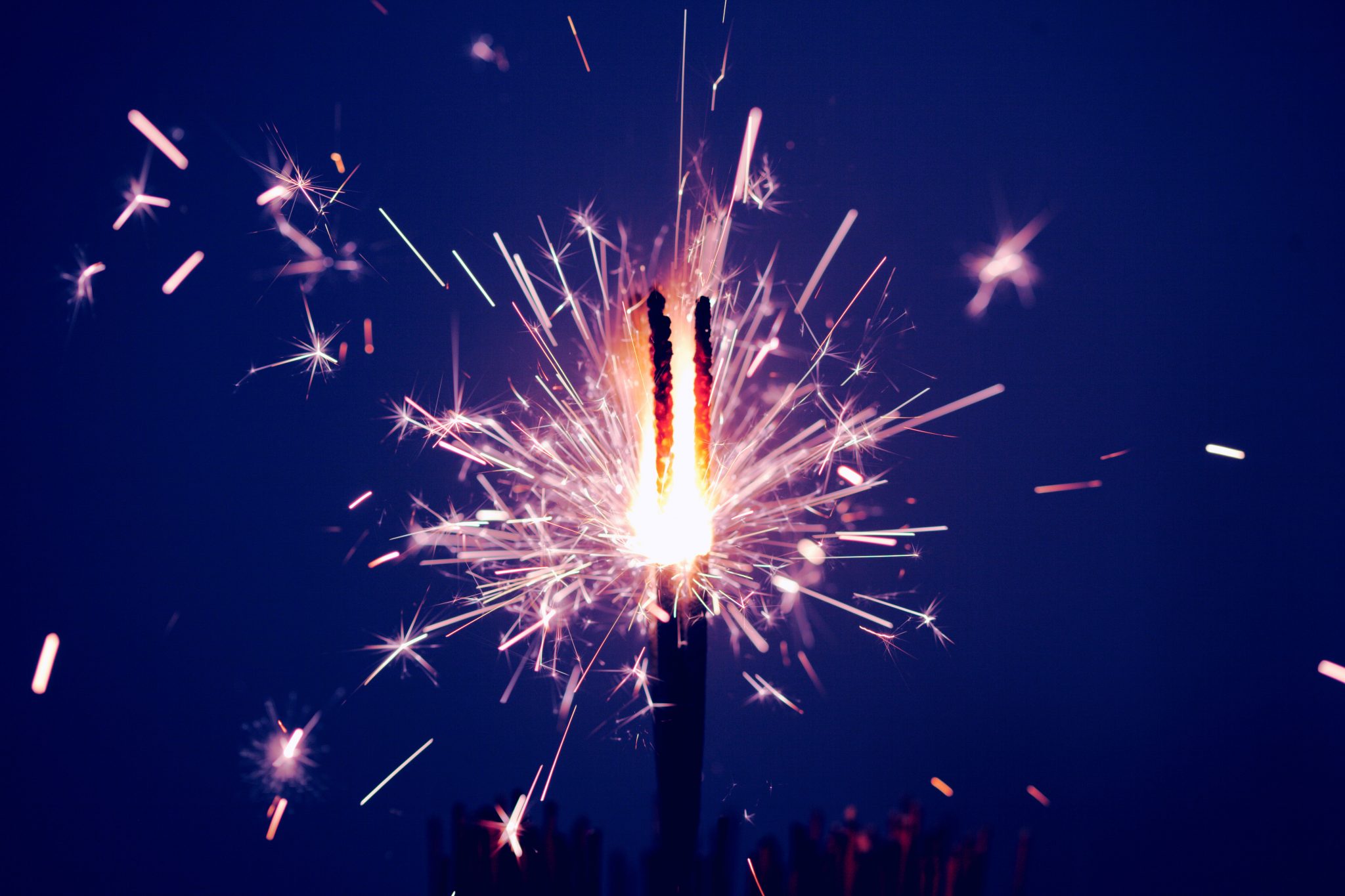 Photo of sparkling firework by sharon mccutcheon on unsplash