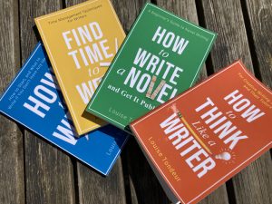 Four small steps writing guides on our garden table July 22